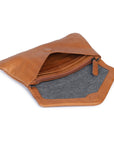 Open tan leather Quinn purse showcasing chargray lining and zipper compartment.