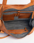 Interior view of the Hannah Overnight Bag showing leather purse compartments and organizer features.