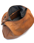 Interior view of the Poppy Bag showcasing its spacious design with dark grey lining and internal pockets.