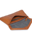 Stylish brown leather purse open, showcasing card slots, internal pocket, and soft gray lining.