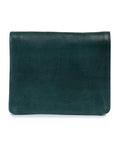 Taylor wallet in forest green leather, compact design for travel essentials, featuring card holders and zip compartment.