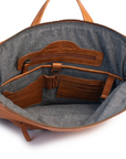 Inside view of Brooklyn Backpack featuring leather pockets and internal organizer for essentials.