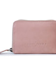 Drew Wallet in soft pink leather, stylish zip-around design with embossed logo, perfect compact leather purse.