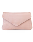Quinn purse in soft blush pink leather with a fold-over flap design and minimalist silhouette.