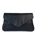 Quinn purse in black leather with fold-over flap and magnetic closure, perfect for organizing essentials.