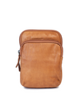 Sophie Bag in soft leather, featuring a minimalist design with zip closure and adjustable crossbody strap.