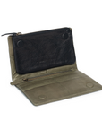 Open leather purse featuring removable magnetic insert, multiple card slots, and zippered section, in dark grey chambray lining.